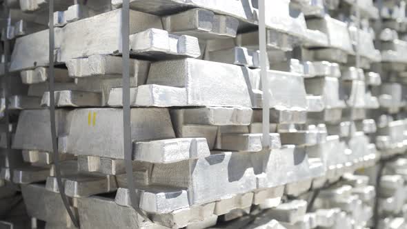 Aluminum Ingots in Stock Warehouse. Billets for Aluminium Profile Production at a Metallurgical