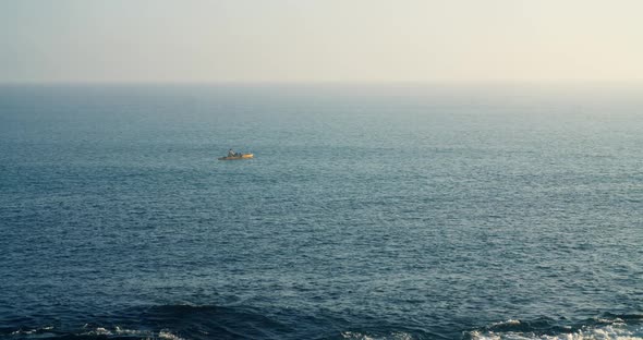 Seascape with Fisherman on Horizon on Catamaran Kayak Fishing Alone