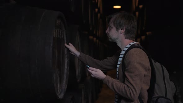 Old Wine Barrels in a Wine Cellar Sommelier Man Tourist Dicover Porto Portugal Old Factory Stock