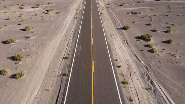 Aerial shot of a remote desert road with no cars in Nevada