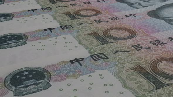 10 Chinese Yuan bills background. Many banknotes.