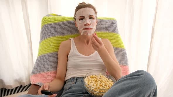 Woman with a Remote and Popcorn