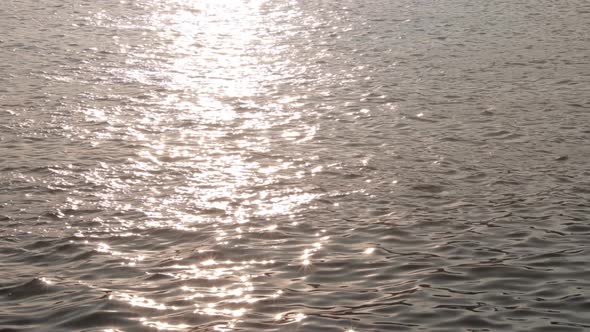 light reflection on the water surface around sunset time