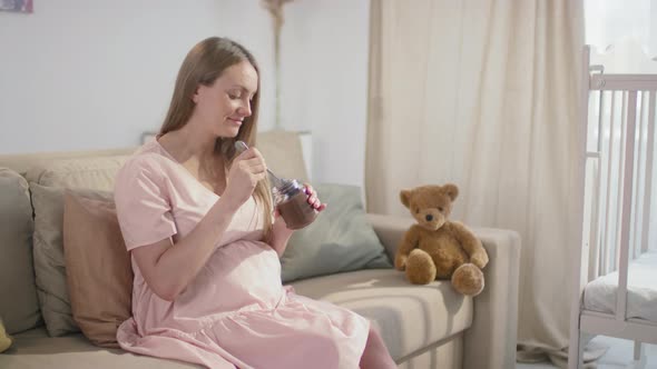 Pregnant Woman Eating Chocolate Spread