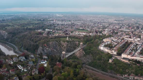 Circling rising drone shot of the Clifton suspension bridge and Bristol