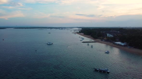 Drone Fly Over Boats Near to Beach on Sunset