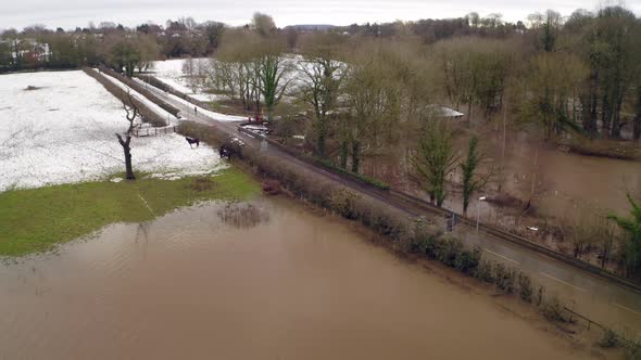 Aerial footage from Drone showing the river Bollin in Wilmslow, Cheshire after heavy rain and with b