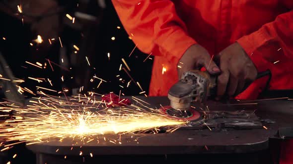 Professional Mechanic is Cutting Steel Metal