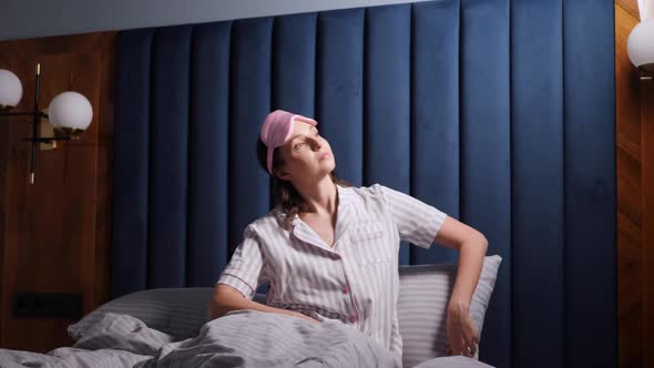 Woman in a Pink Eye Mask Woke Up in a Bed at Home