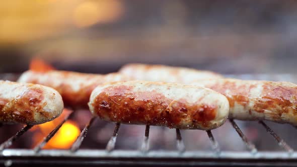 Delicious Juicy Sausages, Cooked on the Grill with a Fire