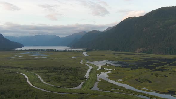 Beautiful Aerial Panoramic View of Canadian Mountain Landscape during a vibrant summer sunset. Taken