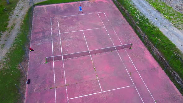 Two Guys Playing Tennis