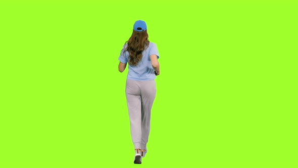 Young Woman Jogging on Chroma Key Background