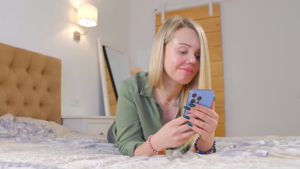 Domestic violence victim female with one eye using modern smartphone for communication