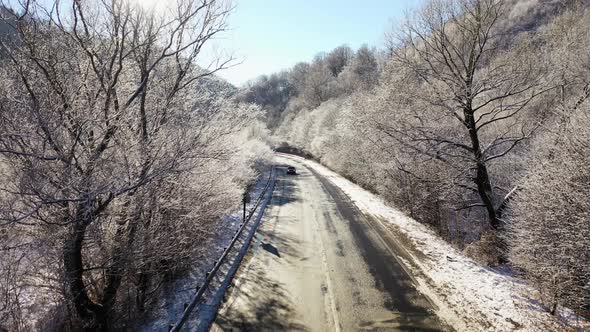 Winter Road and Trees with Snow and Alps Landscape Aerial View