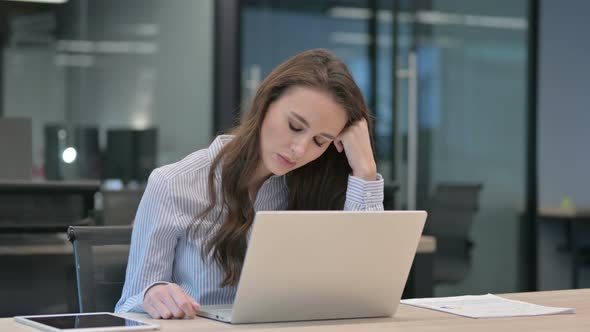 Young African Businessman with Laptop Taking Nap in Office