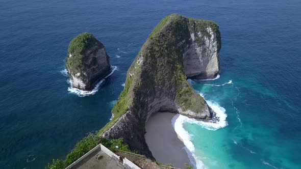 Perfect aerial view flight slowly rise up drone shot edgecliff dinosaur islandKelingking Beach at N