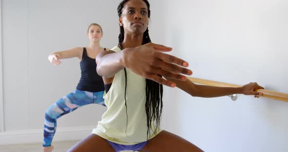 Group of women exercising on the barre 4k