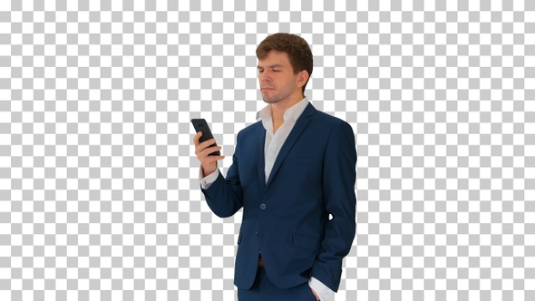 Serious businessman looking at his phone, Alpha Channel