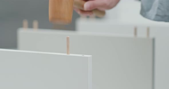 Woman assembling a shelf