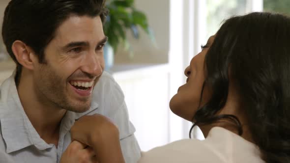 Young man kissing a woman on hand