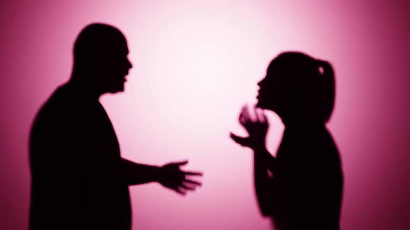 Man and Woman Quarrelling on Pink Background