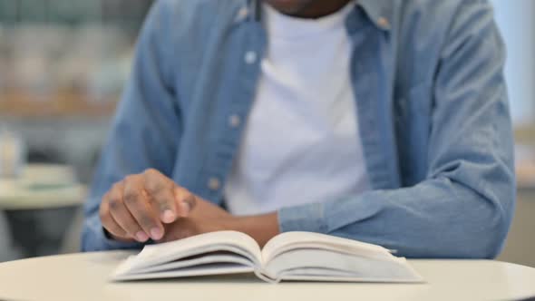 African Man Reading Book Close Up