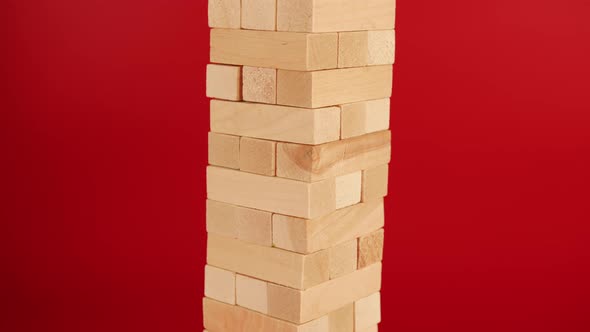 Jenga Game on Red Background