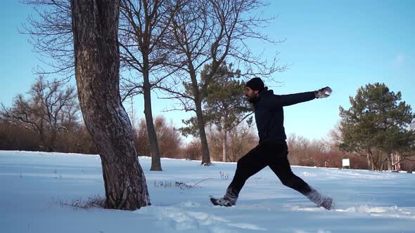 Guy Does Cool Trick Back Flip From Tree in Snowdrift