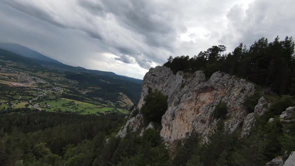 Aerial Cinematic Shot High Speed Sport Fpv Drone Flying Over Natural Mountain Cliff Surrounded