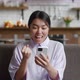 Euphoric Young Asian Woman Using Smart Phone Mobile Celebrating Winning Bid Happy Excited Girl - VideoHive Item for Sale