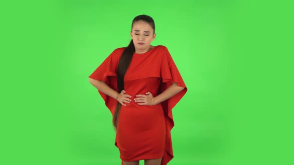 Pretty Young Woman Is Feeling Very Bad, Her Stomach Hurting, Feeling Nausea. Green Screen
