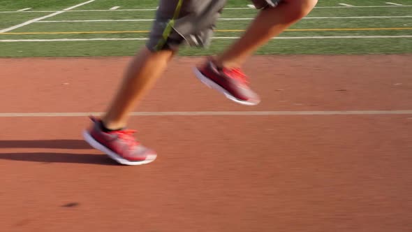 Boy Running On School Track