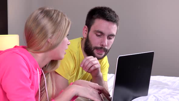 Couple Makes Online Purchases Using Tablet, Closeup