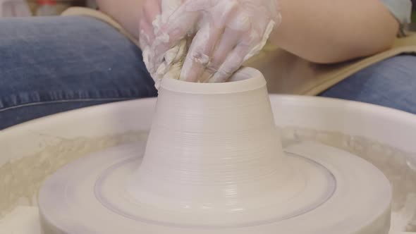 Professional Potter Using Potter Wheel