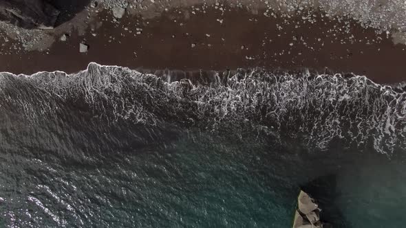 Waves at black sand Formosa Beach in Funchal, Madeira, Portugal