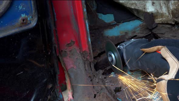 Angle Grinder on Rusty Truck Metal cutting Sparks