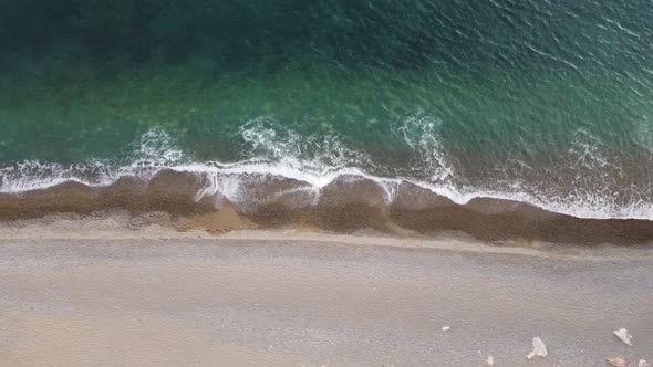 Aerial View From Above on Azure Sea and Pebbles Beach