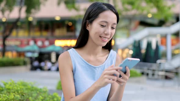 Woman using cellphone for audio message 