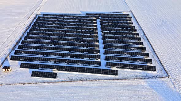 Alternative energy in winter. Snowy solar panels in winter.