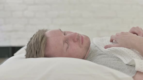 Man Waking Up and Getting Out of Bed