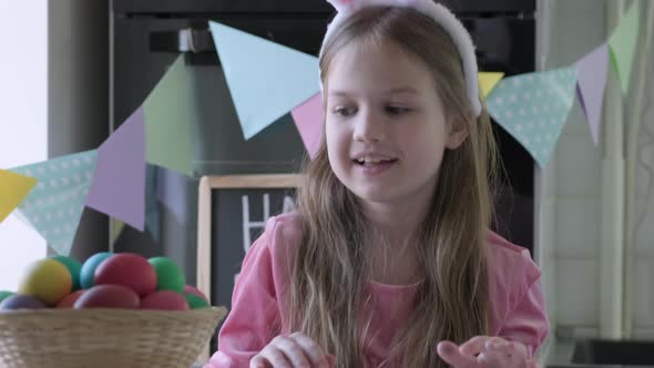 Funny Child Girl with Bunny Ears Play Easter Hare Hunter at Home