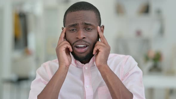 Portrait of Stressed African Man Having Headache 