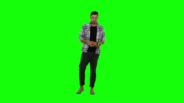 Man Wearing Virtuality Googles. Green Screen