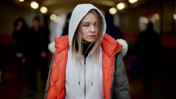 Lost and Tired By Megapolis Woman is Standing in Entrance of Metro Portrait Shot Outdoors