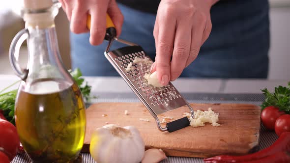 Making Salad Sauce  Grating Garlic at a Domestic Kitchen