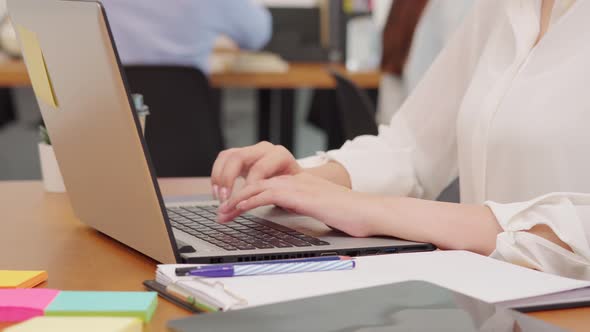 Close up hand of business woman working with laptop at office,Selective focus