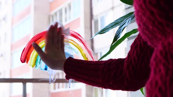 Girl Erases the Rainbow Painted on the Window During Covid19 Quarantine at Home