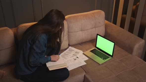 Woman Calling Video on Laptop Green Screen Chromakey Working with Papers Documents