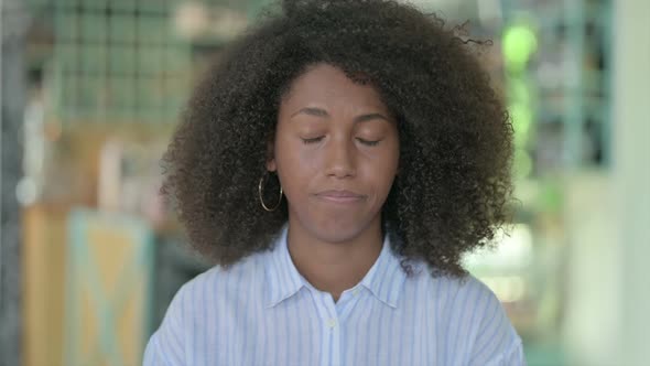 Portrait of Sad African Businesswoman Crying at Camera